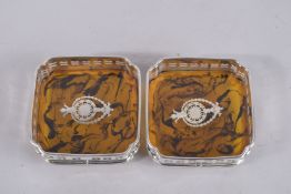 A PAIR OF FAUX TORTOISESHELL AND PLATE SQUARE WINE COASTERS. 5ins.