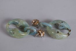 A PAIR OF PRADA GREEN STONE EAR CLIPS, signed.
