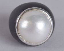 BALOCCHI. A GOOD LARGE BLACK ONYX AND PEARL RING with .750 gold band.