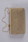 AN ESCADA DIAMANTE GOLD EVENING BAG on a chain, in a dust wrapper. 8ins high.