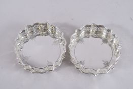 A PAIR OF PIERCED PLATE CIRCULAR WINE COASTERS. 5ins.