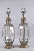 A PAIR OF METAL HANGING LANTERNS with flower top, 27ins high.