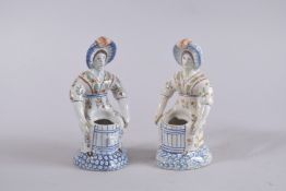 A GOOD PAIR OF POLYCHROME FIGURE SALTS. 7ins high.