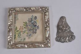 A FRAMED NEEDLEWORK PICTURE, 5.5ins x 5.5ins, and a plated plaque, Madonna and Child, 5ins.