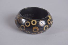 A KENNETH LANE VINTAGE BLACK BANGLE. 10cm diameter.