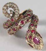 A 9CT GOLD, RUBY AND DIAMOND SET SNAKE RING.