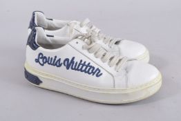 A PAIR OF LOUIS VUITTON TRAINERS, size 39. Signs of wear.