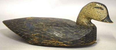 A LARGE CARVED WOOD AND PAINTED DECOY DUCK. 20ins high.