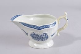 A WORCESTER BLUE AND WHITE SAUCEBOAT. 7.25ins high.