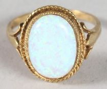 A SILVER GOLD PLATED OPAL RING.