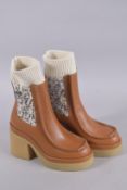 A PAIR OF TAN ANGLE BOOTS 'CHLOE'.