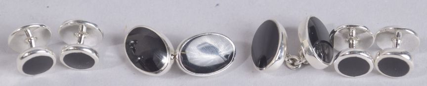 A SET OF STERLING SILVER AND ONYX CUFFLINKS AND STUDS.