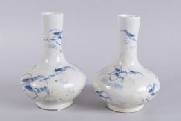 A PAIR OF CHINESE BLUE AND WHITE CRAYFISH VASES. 9ins high.