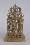 A GOOD GILT BRONZE SHRINE with three figures. 11ins high.