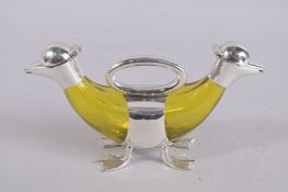 AN AMBER GLASS NOVELTY DECANTER with duck head. 10ins high.