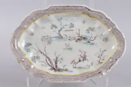 AN 18TH CENTURY MANGANESE AND POLYCHROME OVAL DISH. 13ins high.