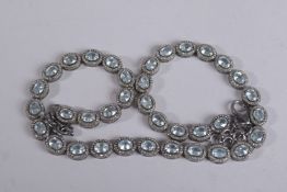 A BLACK RHODIUM- PLATED SILVER DRESS NECKLACE set with oval mint green kyanites, each surrounded