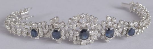 A SUPERB 18CT WHITE GOLD SAPPHIRE AND DIAMOND BRACELET set with four sapphires and 160 diamonds.