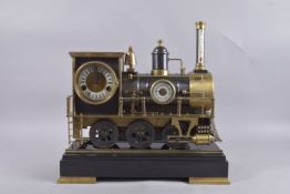 A GOOD INDUSTRIAL TRAIN THREE DIAL CLOCK on a marble base. 17ins high.