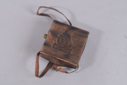 A SMALL MICHELIN MAGNIFYING GLASS in a leather case.