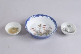 A CHINESE PORCELAIN BOWL; together with two small cups (3).