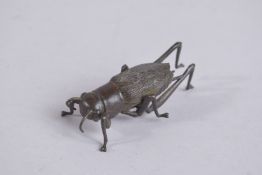 A BRONZE OKIMONO OF A BEETLE, with articulated legs.