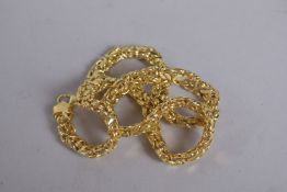 A SILVER GILT CHAIN 18ins long.