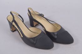 A PAIR OF CHANEL BLACK CELINE COURT SHOES, size 45. Boxed, some wear.