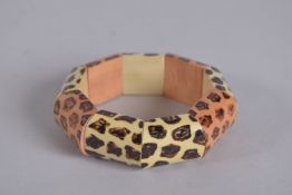 A KENNETH LANE VINTAGE LEOPARD PRINT FLEXIBLE BRACELET, signed, 3ins diameter