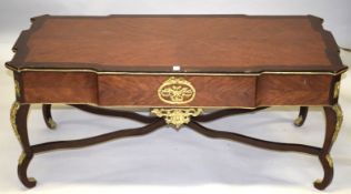 A LOUIS XVI STYLE RECTANGULAR TOP COFFEE TABLE with ormolu mounts, on four curving legs with cross