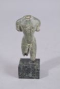 A SMALL ROMAN OR HELLENISTIC BRONZE TORSO. 2.75ins high, on a marble base.