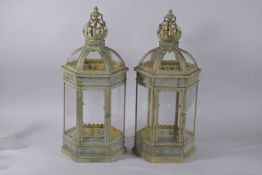 A PAIR OF GILT METAL OCTAGONAL METAL LANTERNS with crown tops. 24ins high.