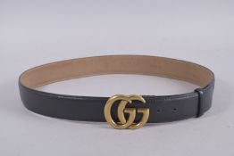 A GUCCI BLACK LEATHER BELT. 39ins long.