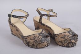 A PAIR OF JIMMY CHOO FLAT FABRIC SHOES, size 38. Signs of wear.