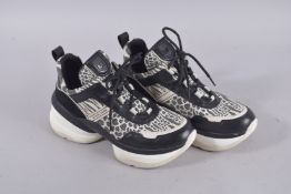 A PAIR OF MICHAEL KORS TRAINERS. Signs of wear.