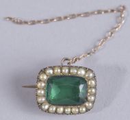 A TINY SEED PEARL BROOCH.