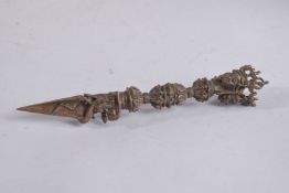 A TIBETAN MULTI-FACE VAJRA RITUAL DAGGER. 20cm long.