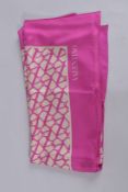 A VALENTINO PINK SILK SCARF. 70ins x 38ins, in a box.