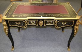 A GOOD BOULLE BUREAU PLAT with leather top, three frieze drawers, ormolu mounts and masks, on