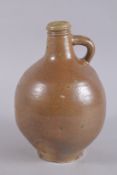 A GOOD BELLARMINE JUG with impressed marks. 11ins high.
