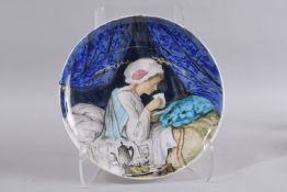 THEODORE DECK. A 19TH CENTURY CERAMIC CHARGER with a scene of a young woman having tea in bed.