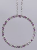AN 18CT GOLD PINK SAPPHIRE PENDANT AND CHAIN.