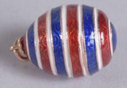 A 14CT GOLD STRIPED EGG PENDANT.