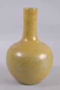 A CHINESE YELLOW GLAZE VASE. 33cm high.