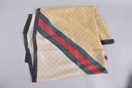 A GUCCI SILK SCARF. 36ins x 36ins, in a Gucci box.