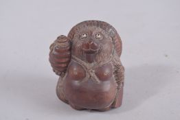 A JAPANESE CARVED WOOD BEAR, signed, and SNAIL, signed. 3ins.