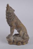 A BRONZE HOWLING FOX. 9.5ins high.