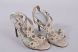 A PAIR OF SERGIO BLACK SNAKESKIN HIGH HEELS, size 37, in a bag. Signs of wear.