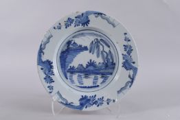AN 18TH CENTURY ENGLISH BLUE AND WHITE TIN GLAZE CHARGER. 14ins.