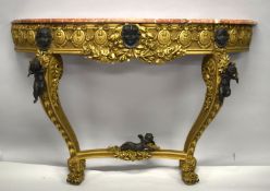 A LOUIS XVI STYLE GILTWOOD MARBLE TOP CONSOLE TABLE with bronze cupids. 4ft 3ins long x 1ft 4ins